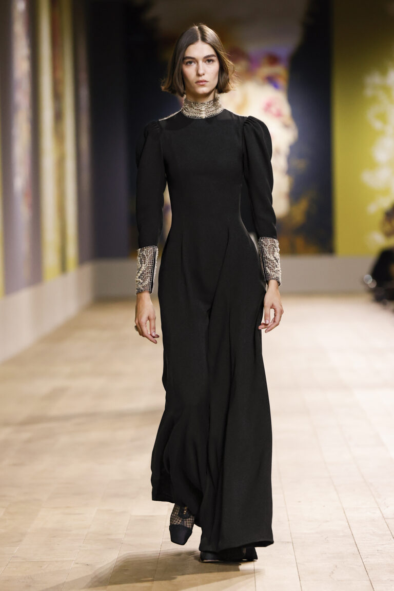 Long silk crepe dress embroidered with tree of life bouquet in mouline thread, matching neckline and sleeve cuff.