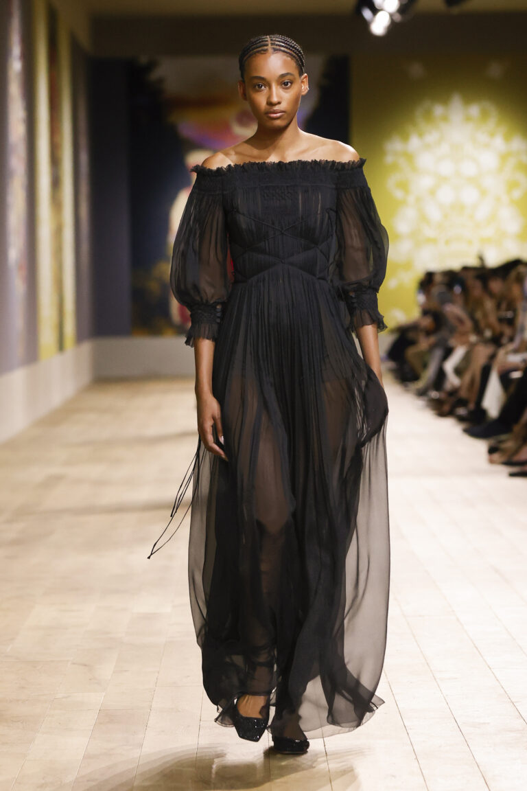 Black silk chiffon dress, geometric smocked hems embroidered with tone-on-tone geometric patterns.